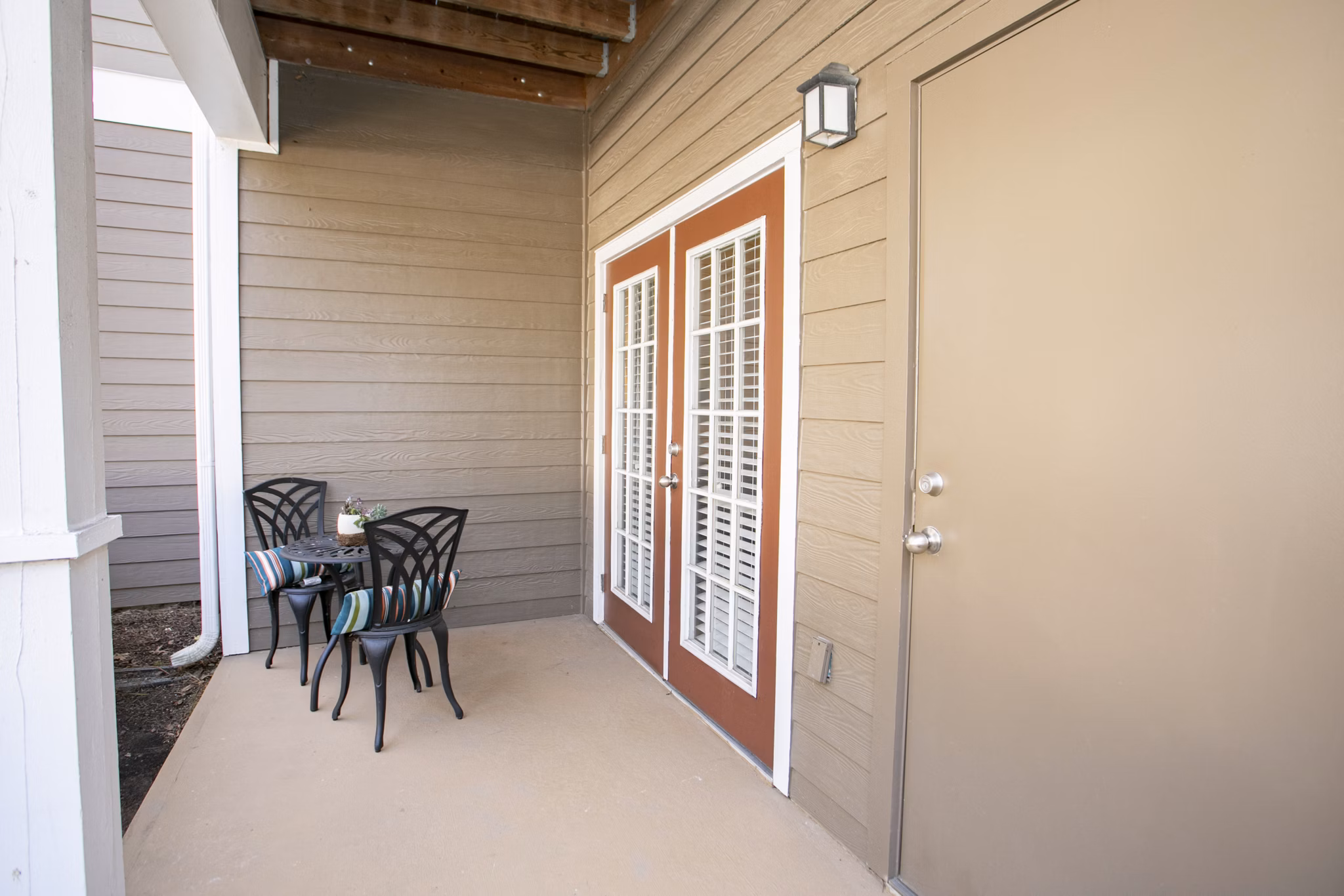 Spacious patio/balcony with lush greenery views at Andover at Johns Creek Apartments