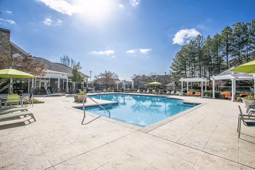 Sparkling outdoor pool at Andover at Johns Creek Apartments providing resort-style relaxation