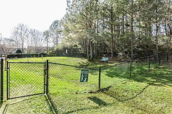 Dog park with agility equipment at Andover at Johns Creek Apartments