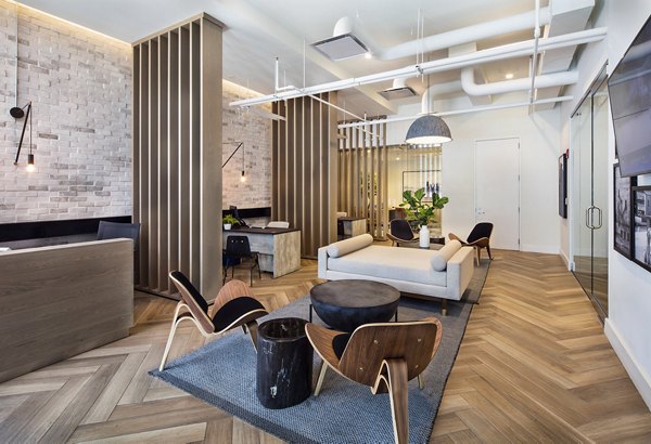 Clubhouse featuring modern design and plush seating at 1401 S State Apartments