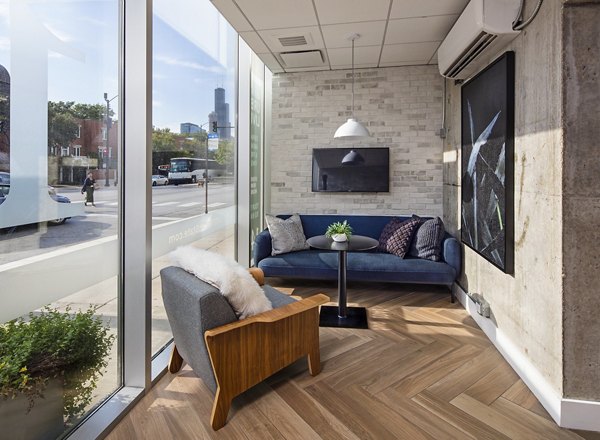 Clubhouse with modern decor and seating areas at 1401 S State Apartments