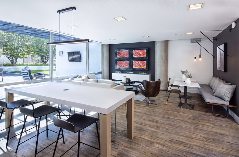 Clubhouse with modern design and cozy seating at 1401 S State Apartments, offering a welcoming space for residents to relax and socialize