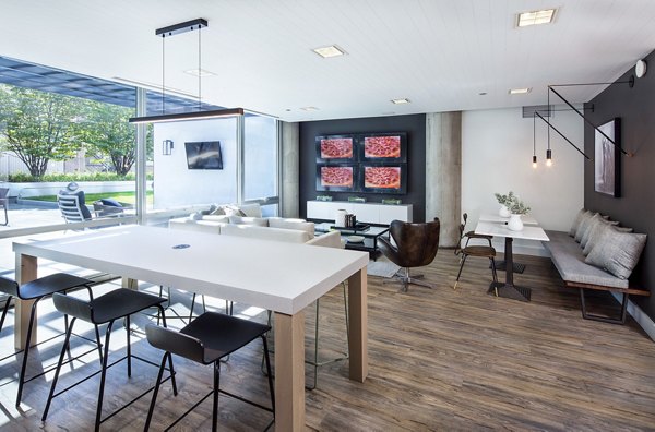 Clubhouse with modern design and cozy seating at 1401 S State Apartments, offering a welcoming space for residents to relax and socialize
