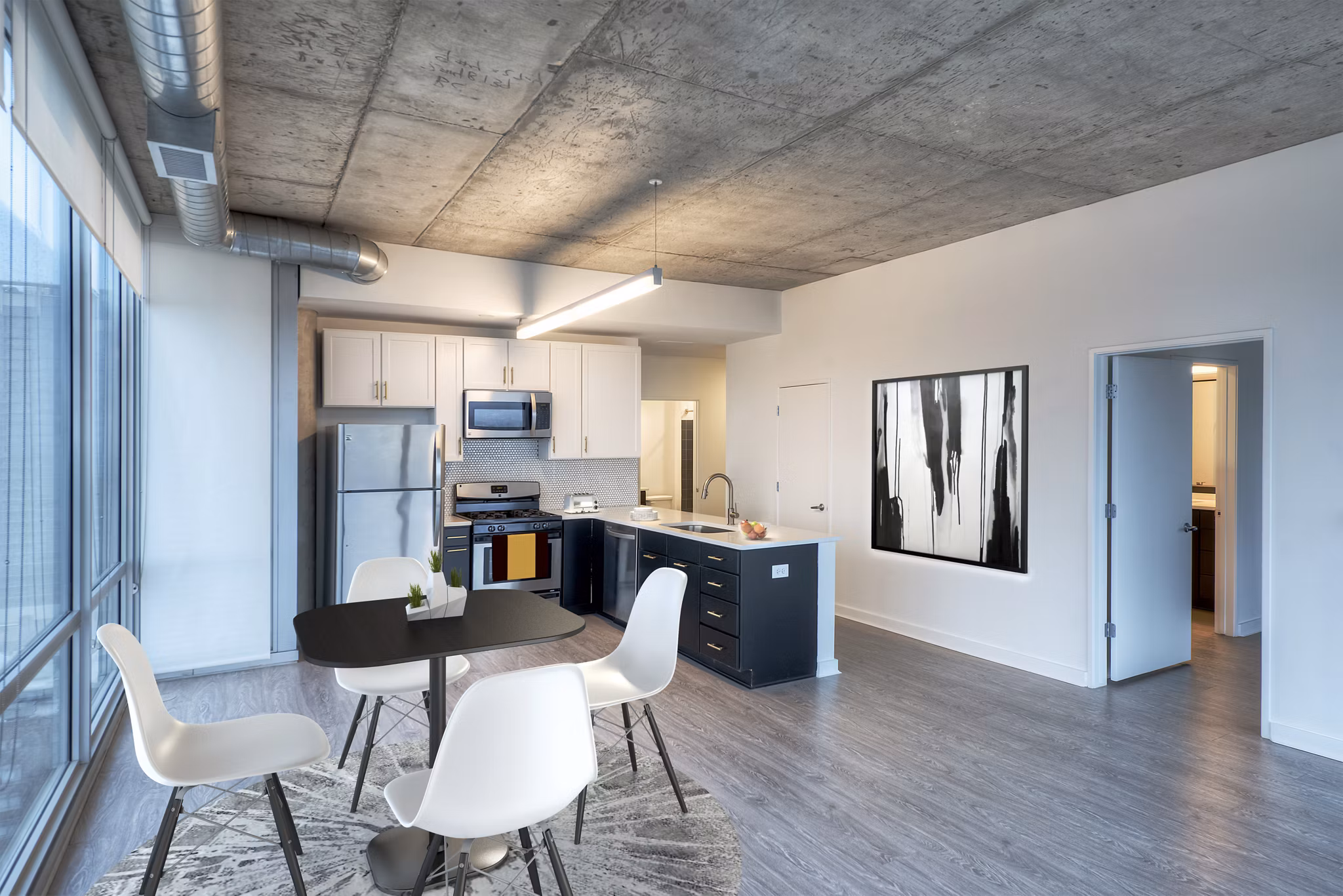 Dining room featuring elegant wooden furniture and modern lighting at 1401 S State Apartments, a luxury living space by Greystar