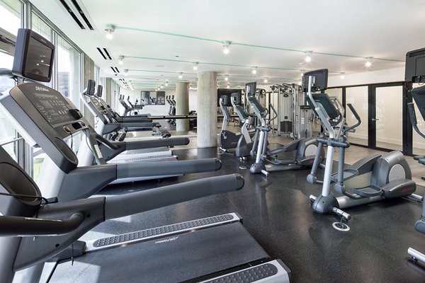 State-of-the-art fitness center with modern equipment at 1401 S State Apartments, ideal for luxury health and fitness enthusiasts