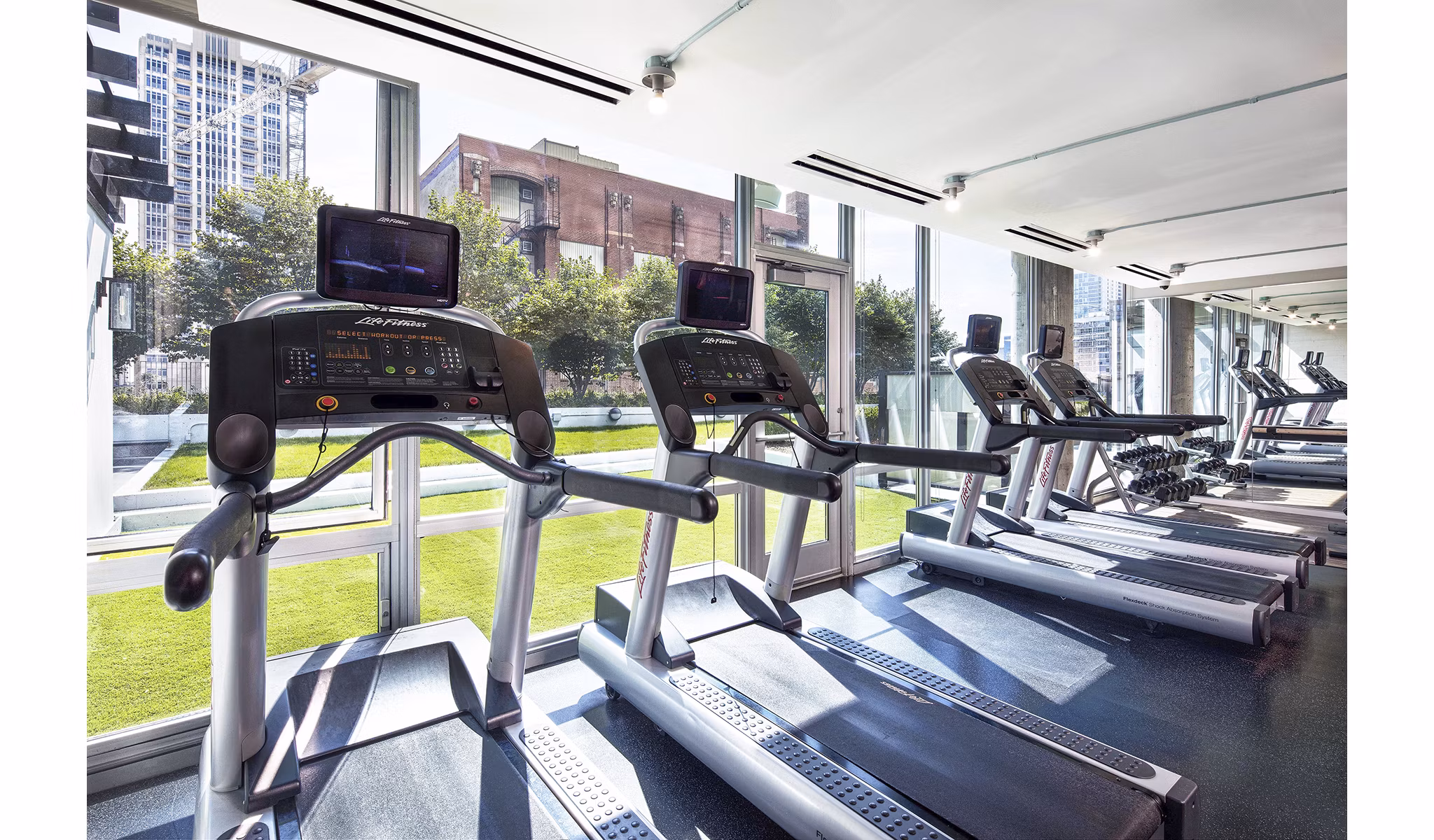 State-of-the-art fitness center with modern equipment at 1401 S State Apartments