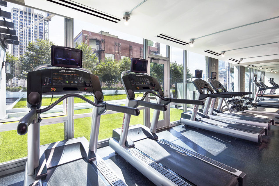 State-of-the-art fitness center with modern equipment at 1401 S State Apartments