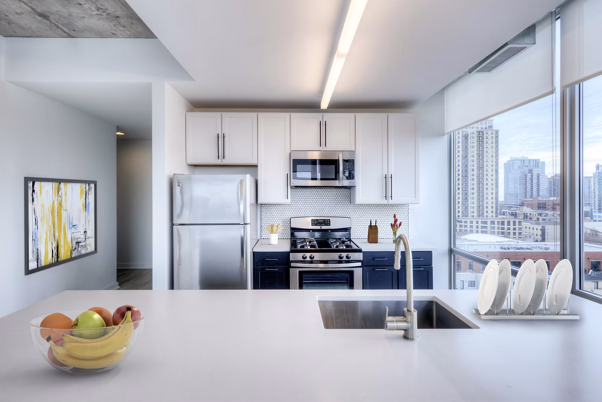 Modern kitchen with stainless steel appliances at 1401 S State Apartments, a Greystar luxury property