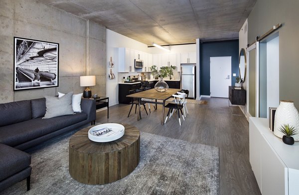 Spacious living room with modern furnishings in 1401 S State Apartments