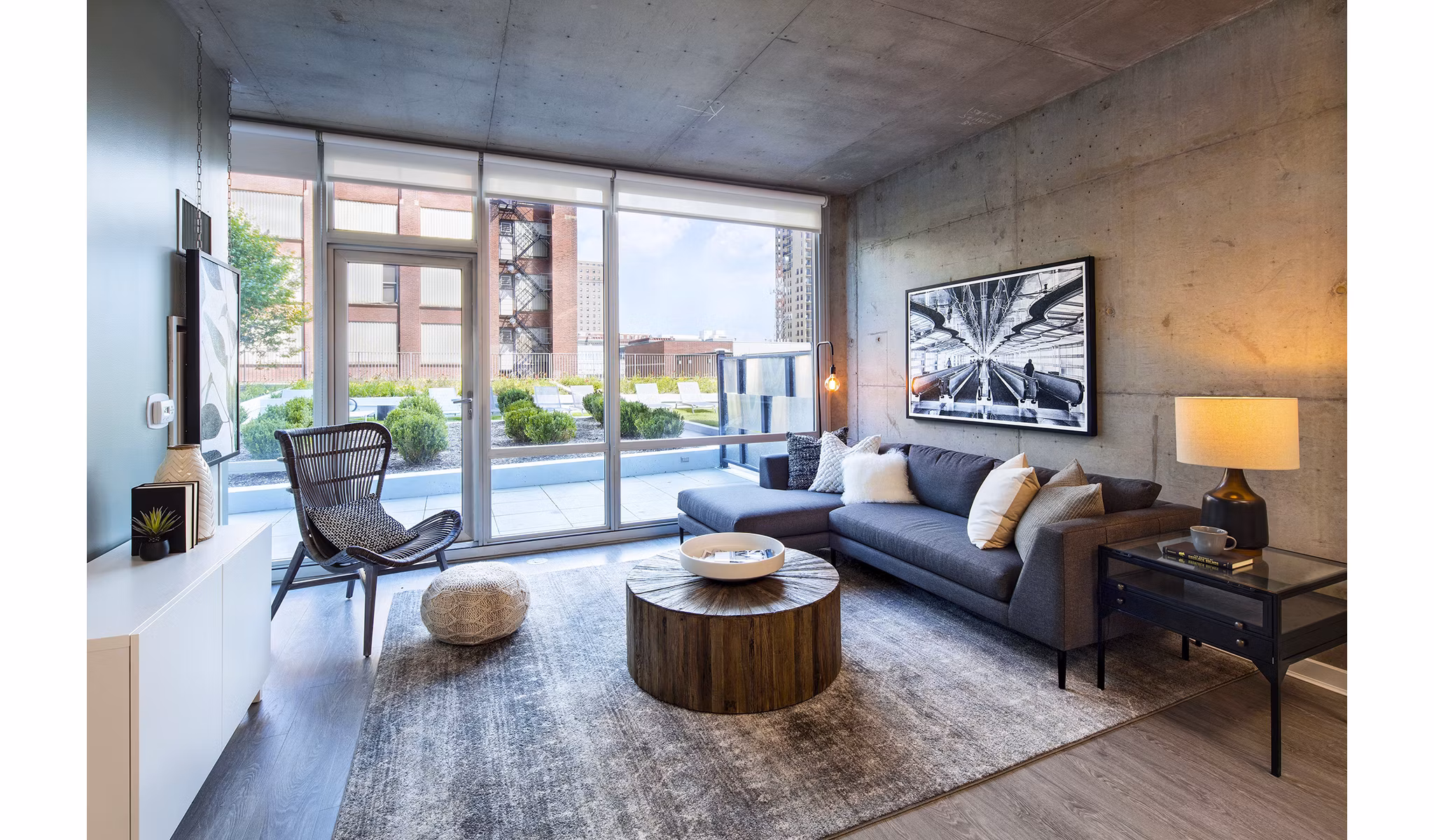 Modern living room featuring sleek furniture and ample natural light at 1401 S State Apartments, offering luxury urban living in Chicago
