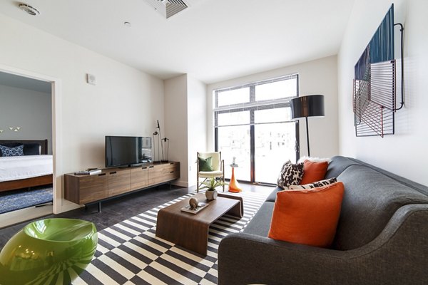 Spacious living room with modern decor at Montaje Apartments