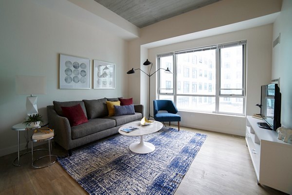 Spacious living room with modern decor in Montaje Apartments, Somerville