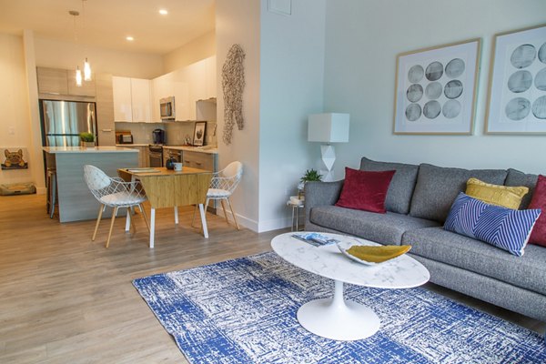 Inviting living room with contemporary furniture at Montaje Apartments, perfect for relaxation and style in a luxurious setting