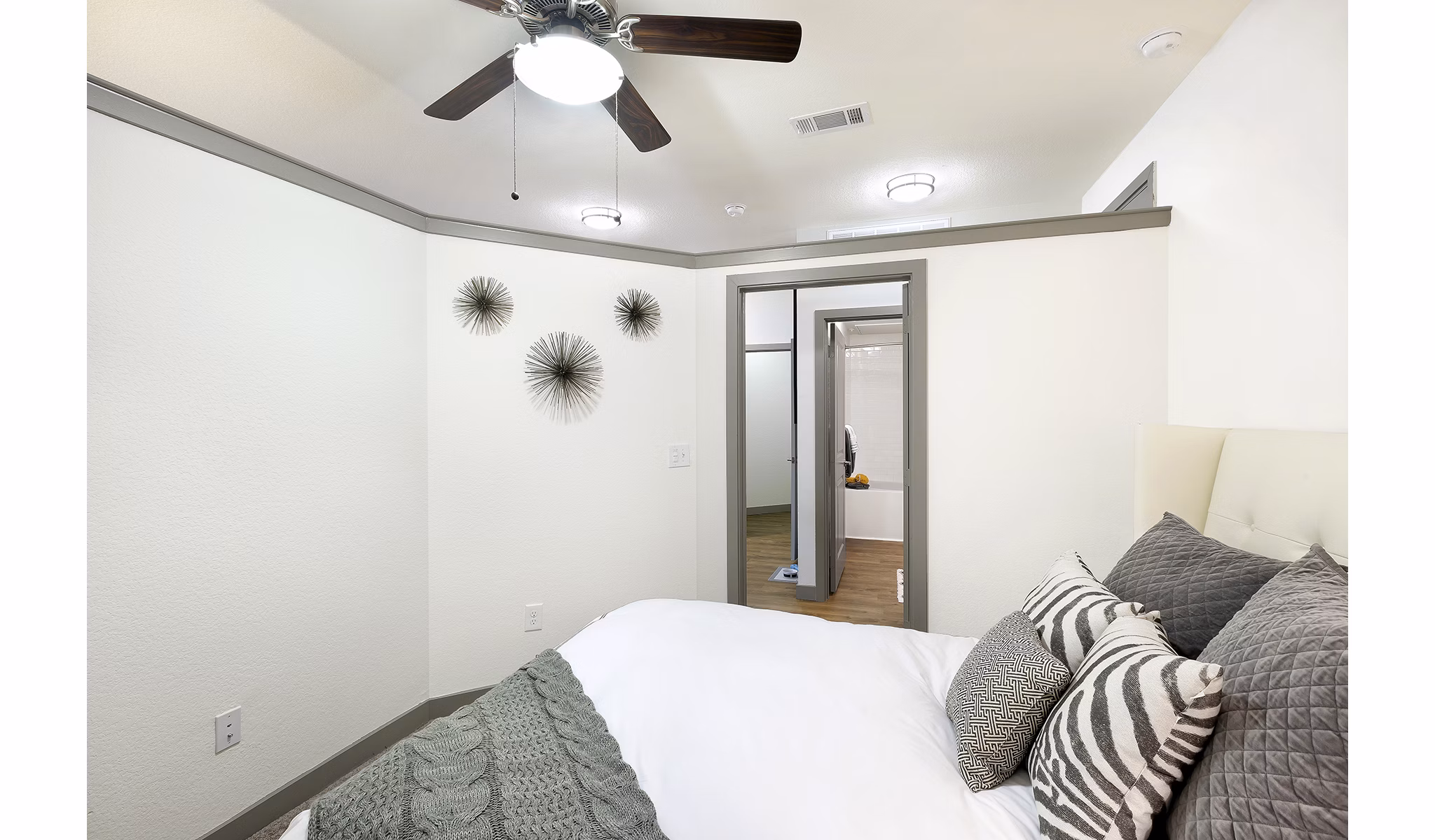 Modern bedroom with sleek decor in West Koenig Flats Apartments