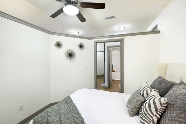 Modern bedroom with sleek decor in West Koenig Flats Apartments
