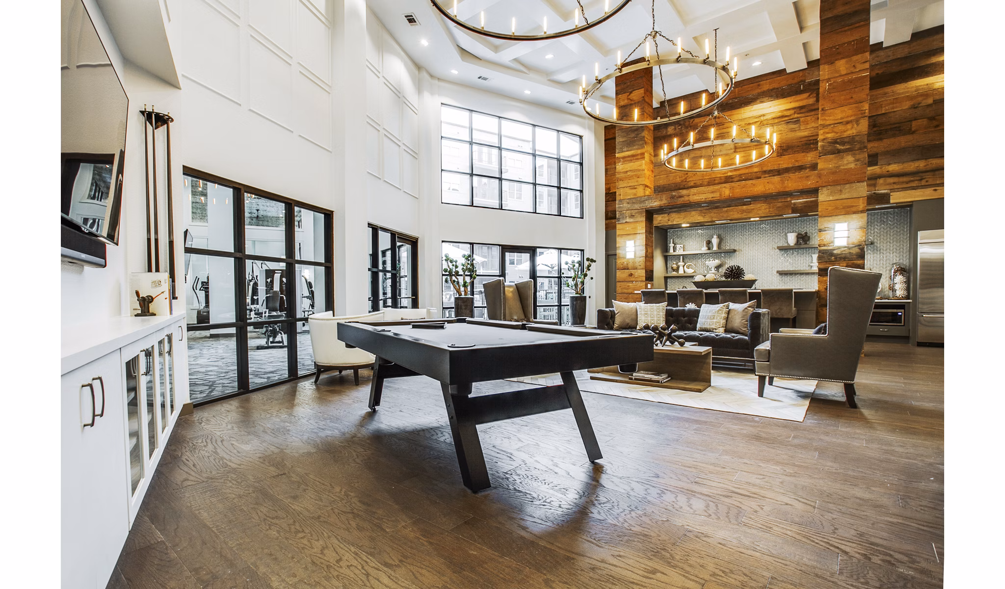 West Koenig Flats: Modern clubhouse and lobby featuring stylish seating and decor in luxury apartments