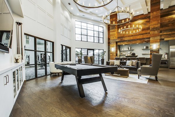 West Koenig Flats: Modern clubhouse and lobby featuring stylish seating and decor in luxury apartments
