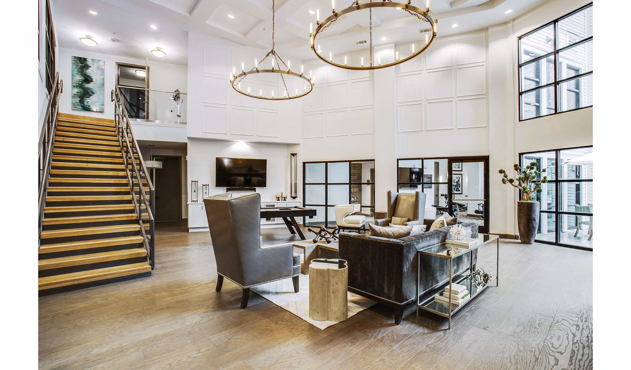 Modern clubhouse lobby with contemporary furnishings at West Koenig Flats Apartments