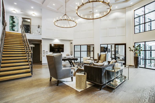 Modern clubhouse lobby with contemporary furnishings at West Koenig Flats Apartments