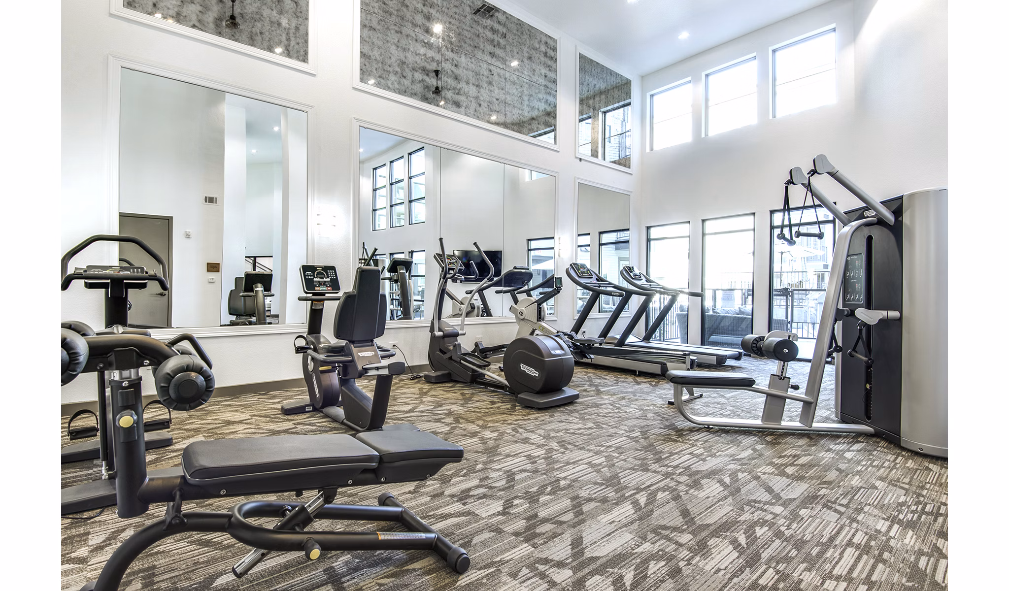 State-of-the-art fitness center with modern equipment at West Koenig Flats Apartments, ideal for an active lifestyle