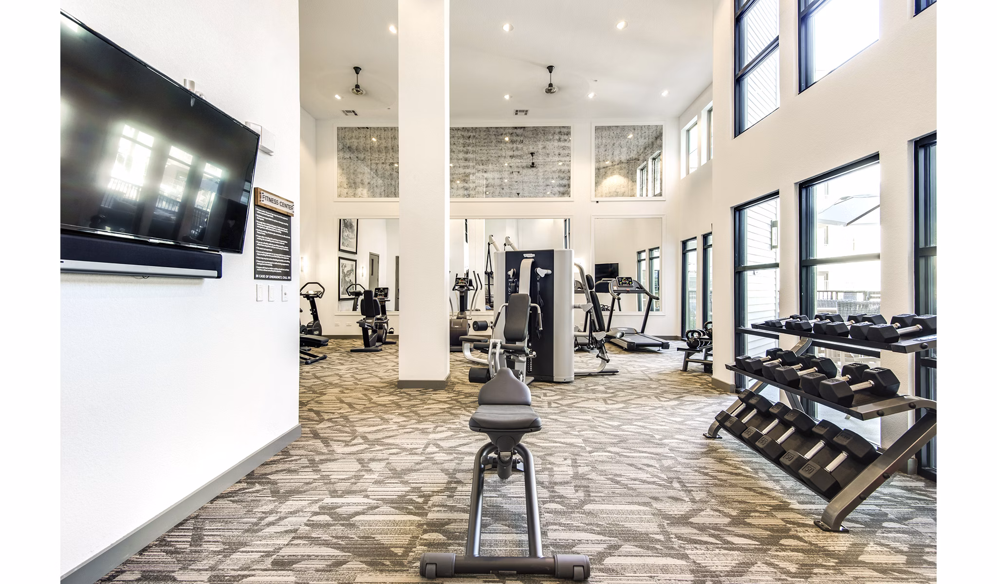 State-of-the-art fitness center with modern equipment at West Koenig Flats Apartments