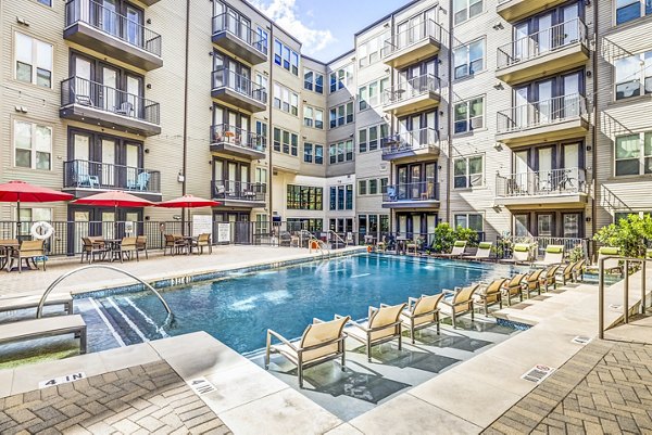 Relax by the sparkling outdoor pool at West Koenig Flats luxury apartments