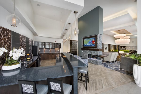 Clubhouse featuring contemporary lounge spaces and community kitchen at Overture Buckhead South Apartments