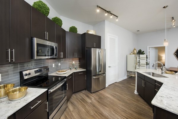 Contemporary kitchen with stainless steel appliances at Overture Buckhead South Apartments