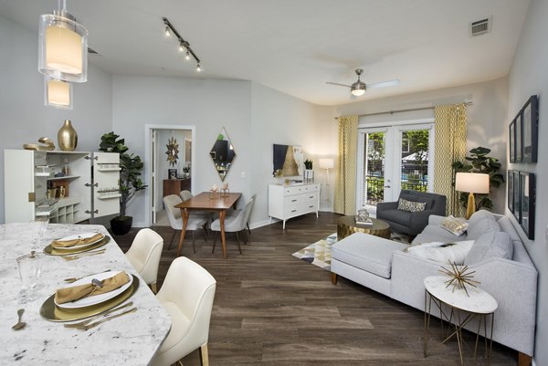 Spacious living room with modern decor and natural lighting at Overture Buckhead South Apartments
