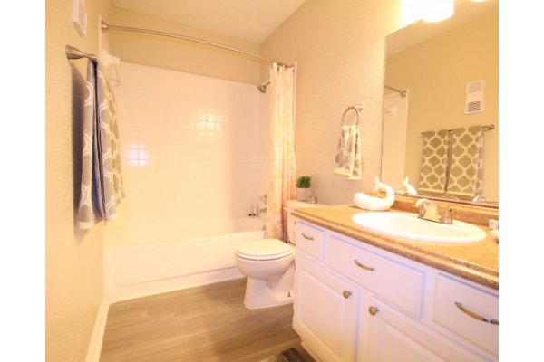 Luxury bathroom with marble countertops and modern fixtures at CP Waterfront Apartments