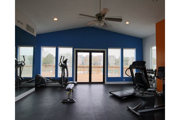 Fitness center with modern equipment at CP Waterfront Apartments, offering a luxury workout experience for residents