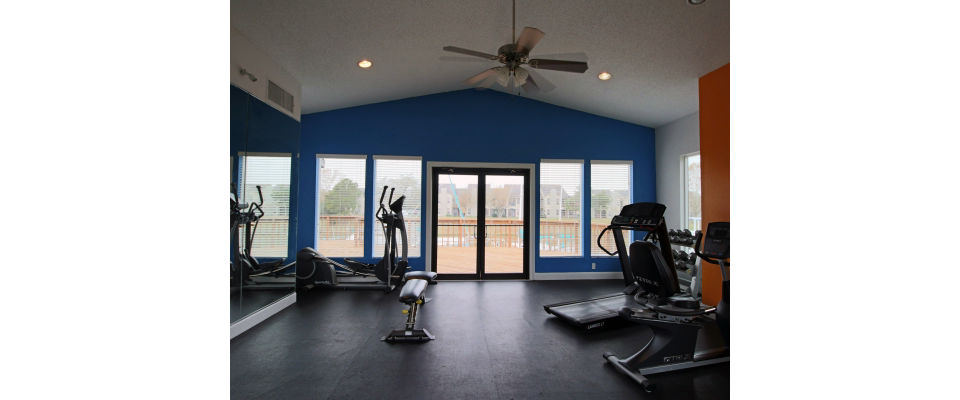 Fitness center with modern equipment at CP Waterfront Apartments, offering a luxury workout experience for residents