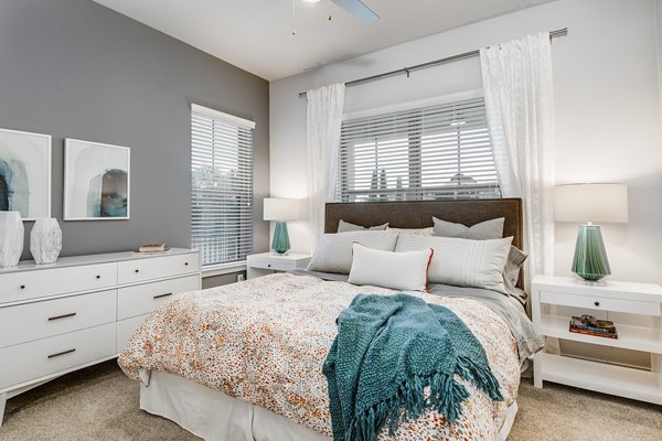Elegant bedroom with contemporary decor at Overture Stone Oak apartments