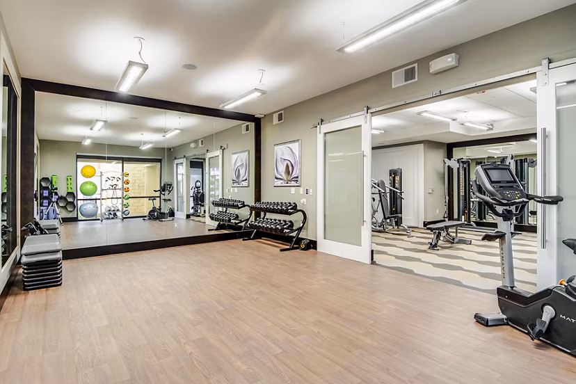 Bright yoga/spin studio with modern fitness equipment at Overture Stone Oak apartments