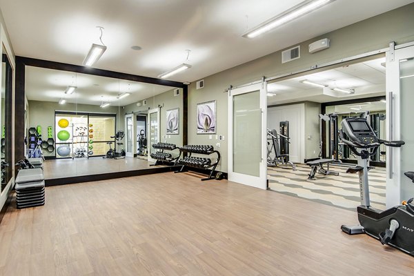Bright yoga/spin studio with modern fitness equipment at Overture Stone Oak apartments