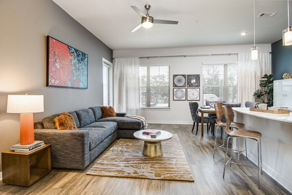 Spacious living room with modern decor at Overture Stone Oak luxury apartments