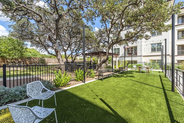 Dog park featuring agility equipment at Overture Stone Oak apartments, pet-friendly luxury living in a vibrant community