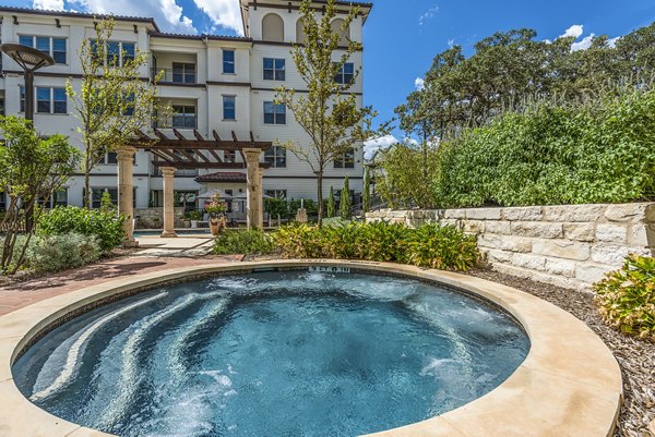 Relaxing hot tub at Overture Stone Oak offering luxurious leisure amenities in an upscale setting