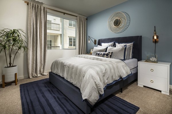 Elegant bedroom with contemporary furnishings at Solaire Apartments, a Greystar luxury community