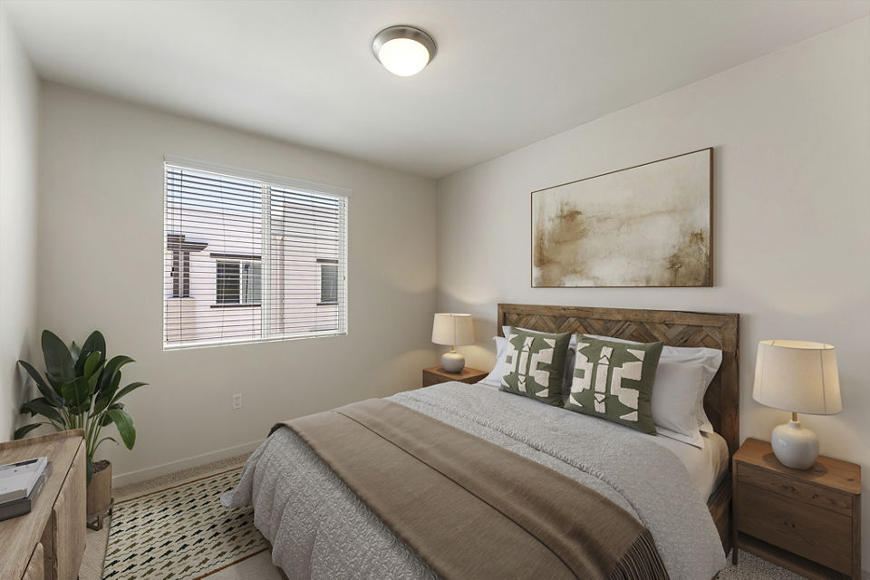 Elegant bedroom with contemporary furnishings at Solaire Apartments, a Greystar luxury community