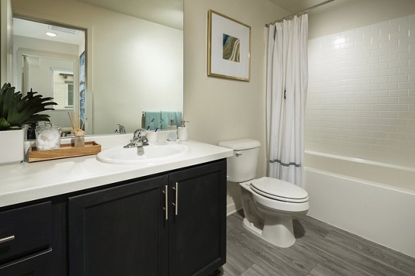 Modern bathroom with quartz countertops and sleek fixtures at Solaire Apartments in San Francisco