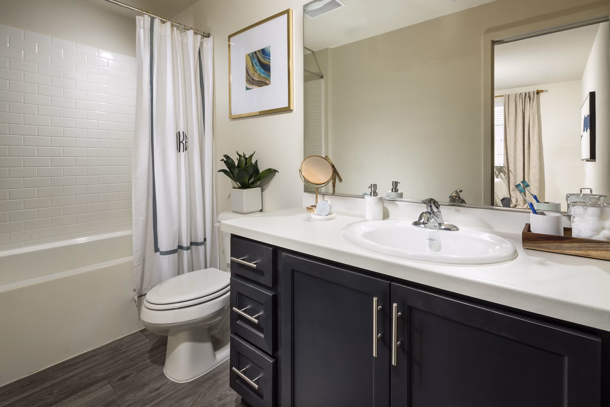 Solaire Apartments: Modern bathroom featuring sleek fixtures and marble accents in luxury setting