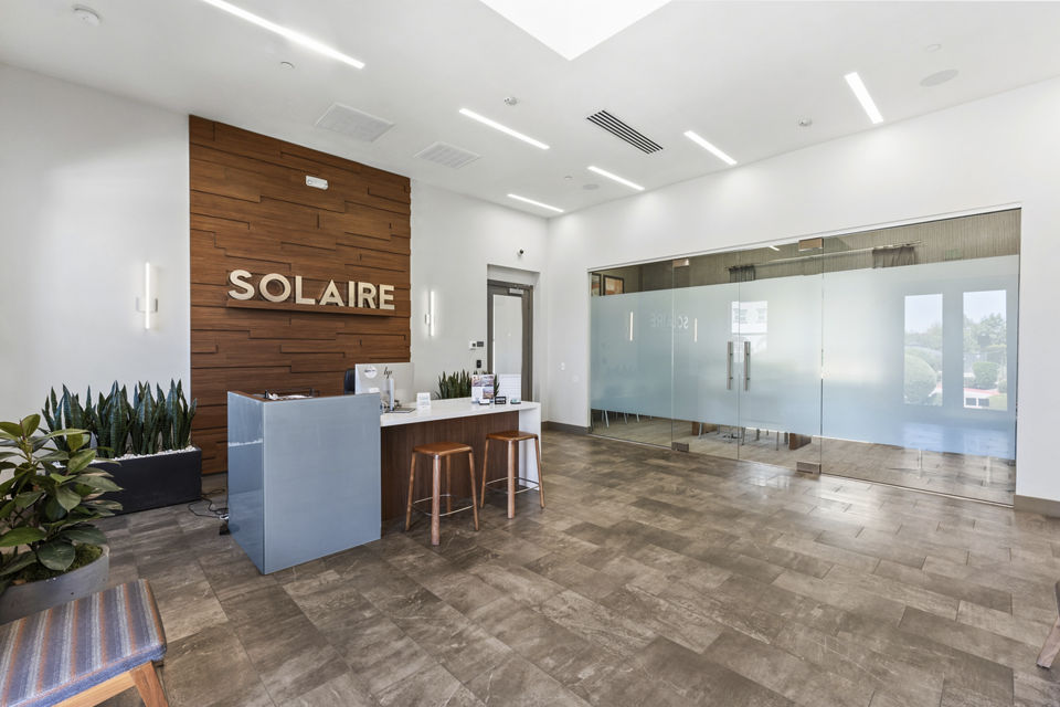 Clubhouse featuring upscale furnishings and modern design at Solaire Apartments in Greystar's luxury community