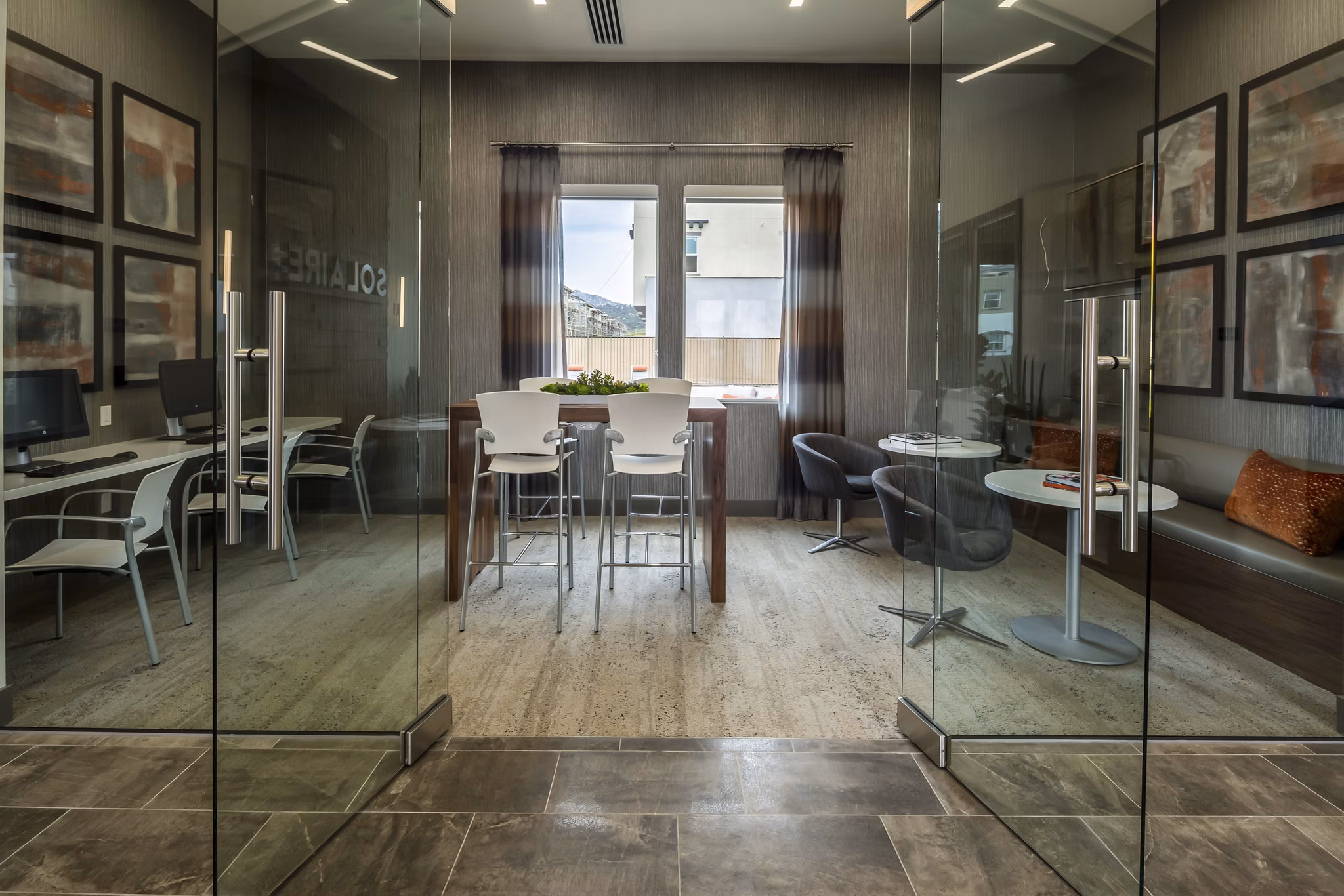 Clubhouse with modern design and cozy seating at Solaire Apartments