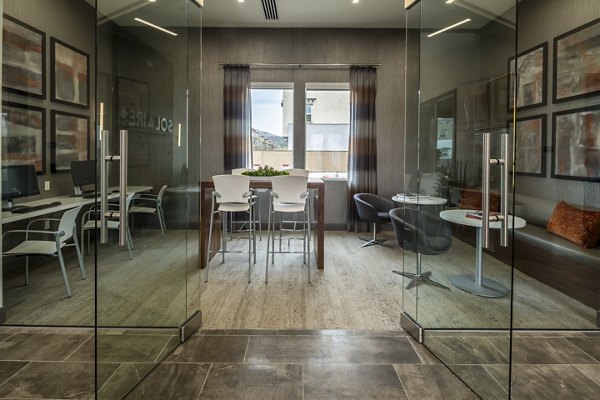 Clubhouse with modern design and cozy seating at Solaire Apartments