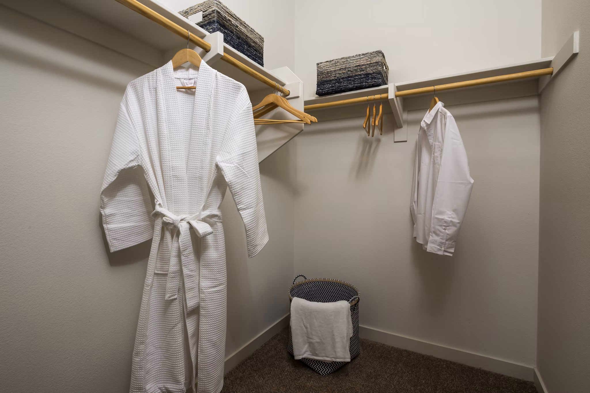 Walk-in closet with built-in shelves at Solaire Apartments, providing ample storage for luxury living