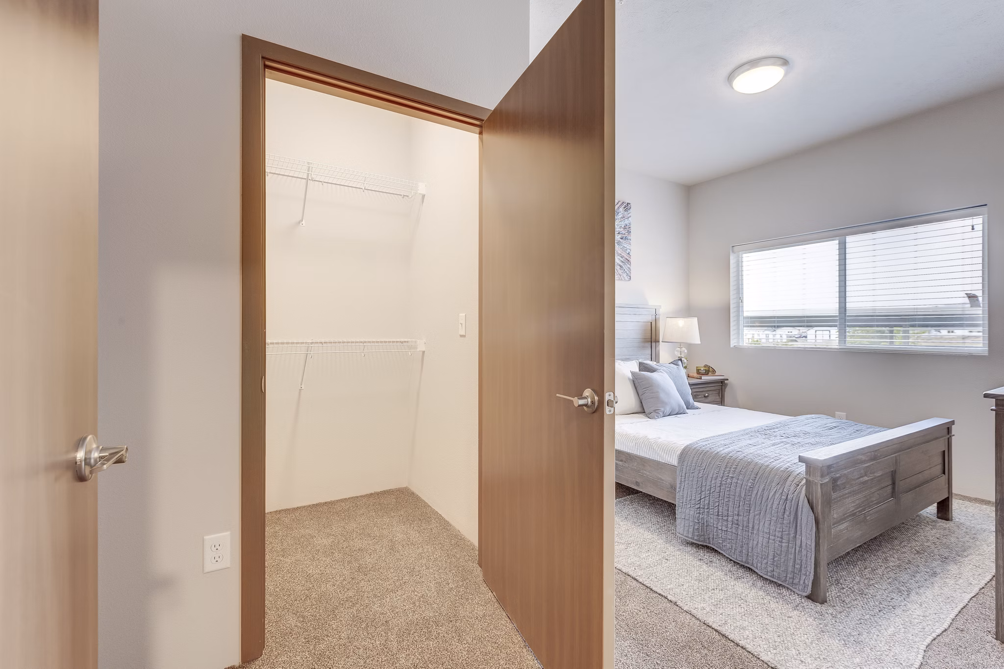 Walk-in closet with ample shelving at Bella Tess Apartments, perfect for organized storage in luxury living spaces