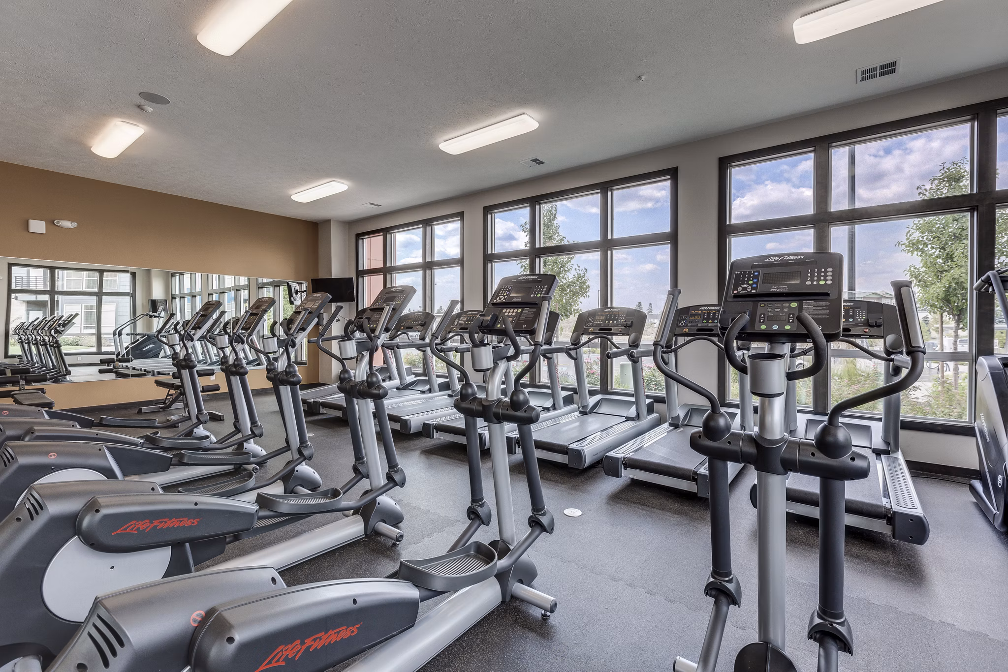 Fitness center with state-of-the-art equipment at Bella Tess Apartments