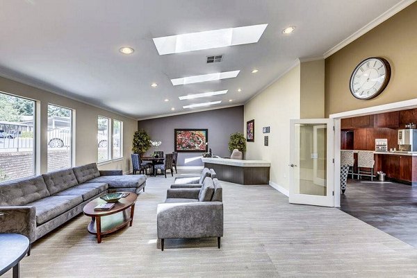 Contemporary clubhouse with modern furnishings at Onyx Apartments, perfect for community events and gatherings