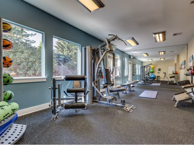 State-of-the-art fitness center with modern equipment at Onyx Apartments, ideal for luxury living and an active lifestyle